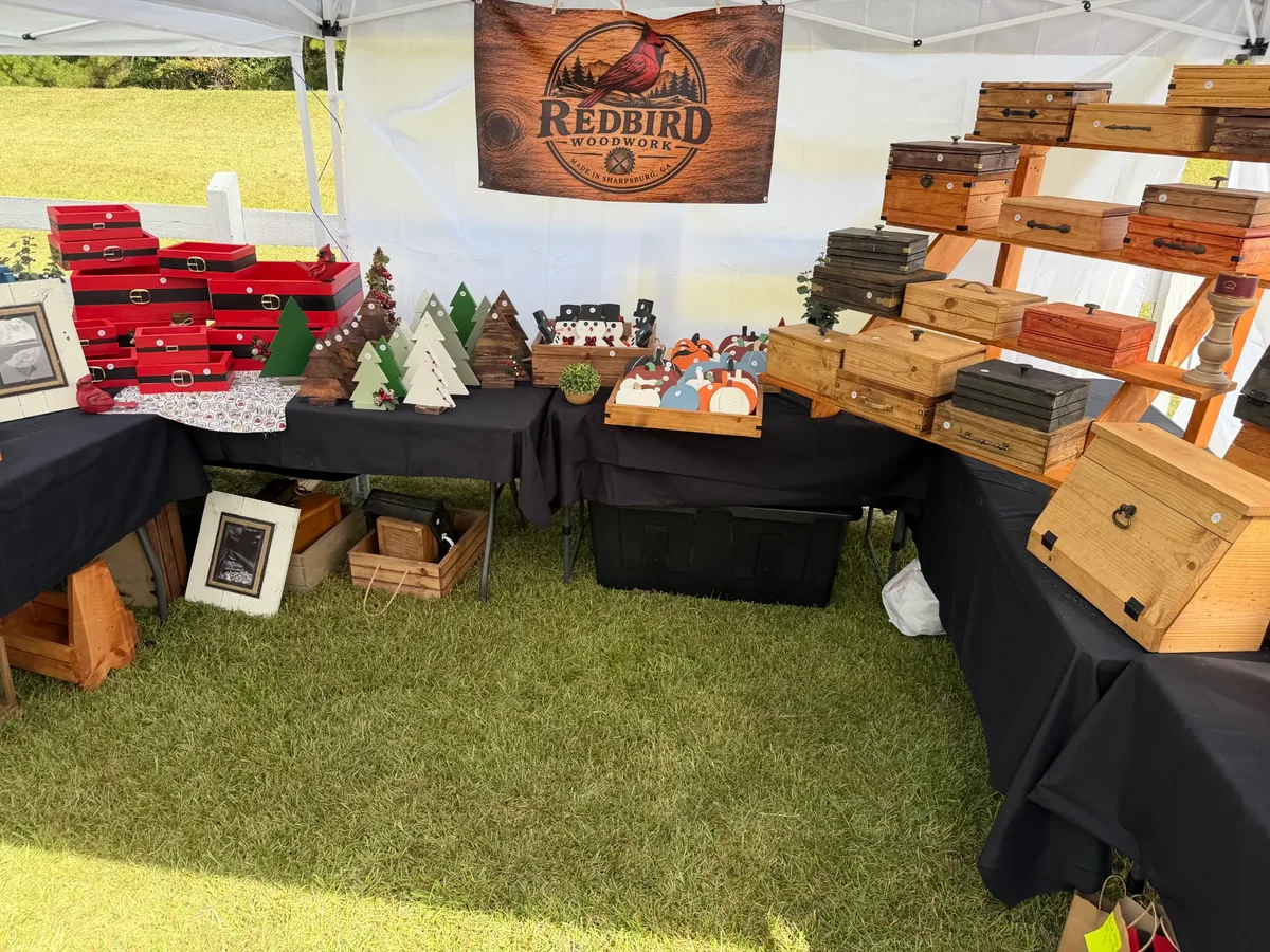 Redbird Woodwork craft-fair display with handmade keepsake boxes and home goods